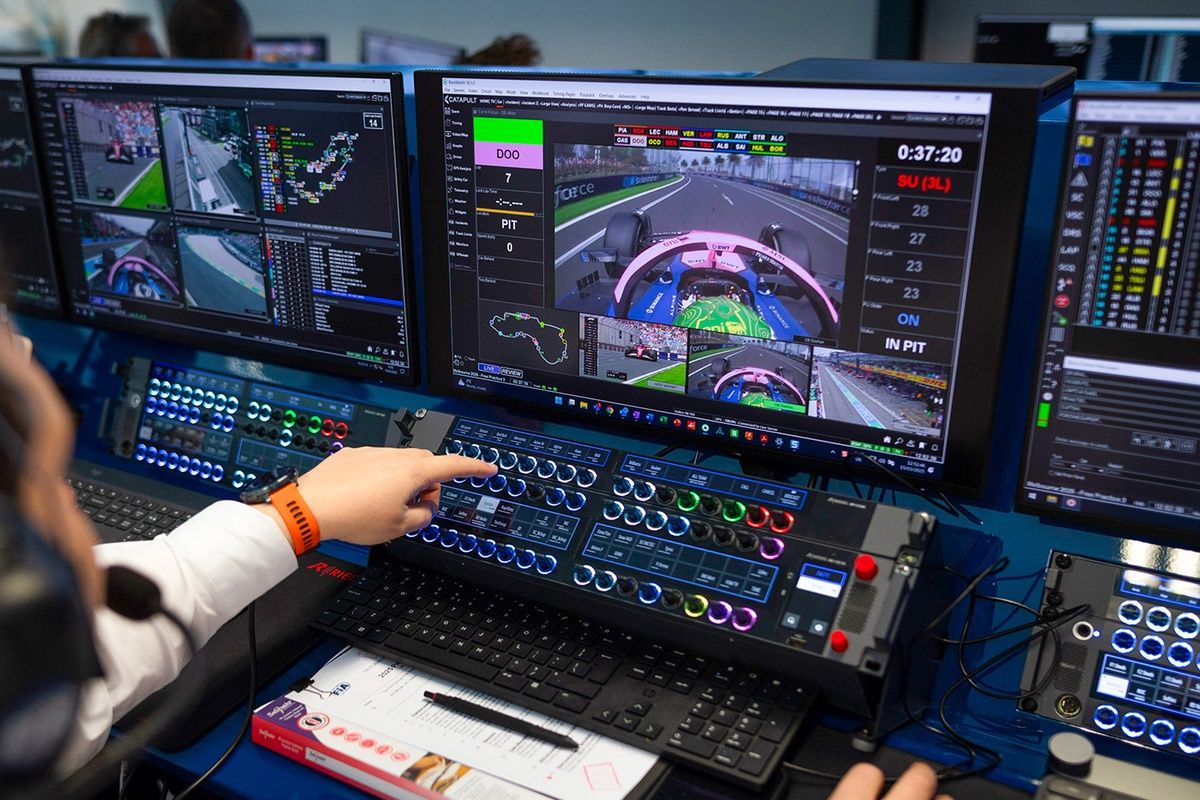 FIA Race Control Operations Room with RaceWatch system monitoring live race data, circuit map, and car positions